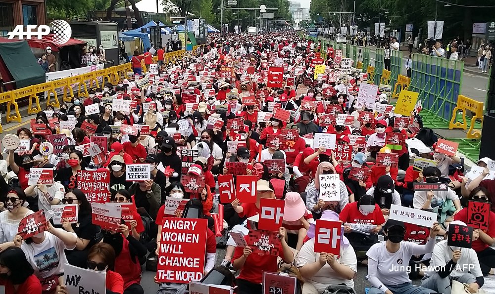 South Korean women march in record numbers to protest spycam video plague - men secretly filming women in schools, offices, trains, toilets, changing rooms    