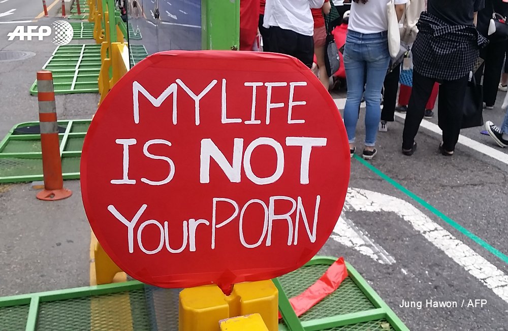 South Korean women march in record numbers to protest spycam video plague - men secretly filming women in schools, offices, trains, toilets, changing rooms    